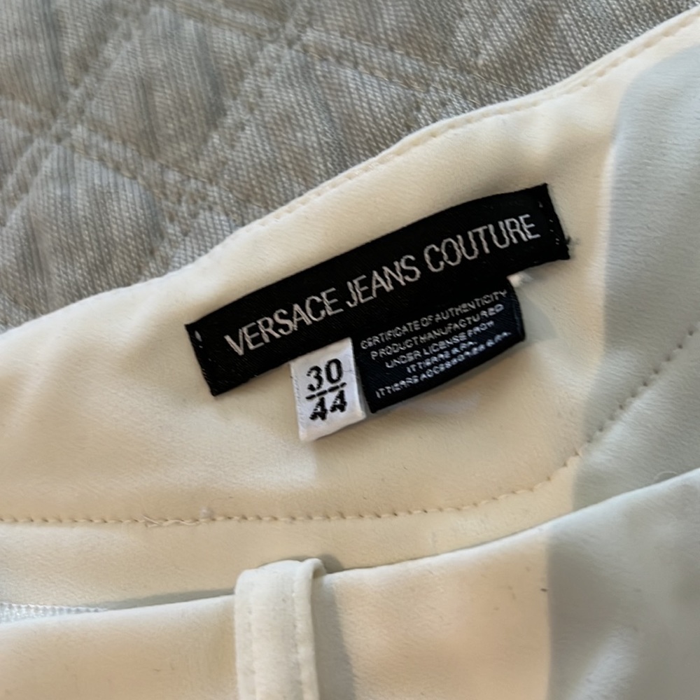 Versace jean off white pants size 44 unique design. Flair bottoms but fitted top